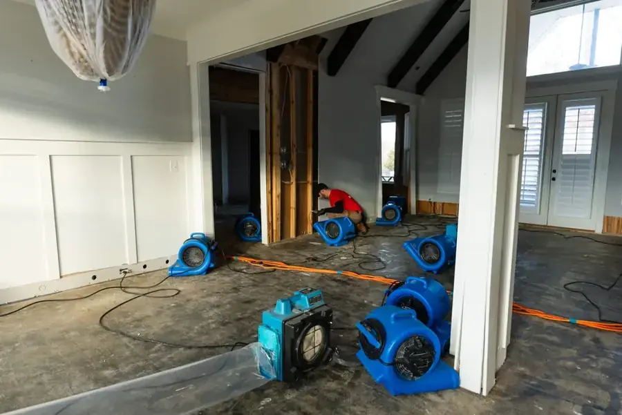 IICRC-certified crew drying a flooded Silver Spring, MD home with air movers