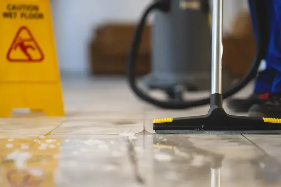 Technician extracting standing water from a Silver Spring floor